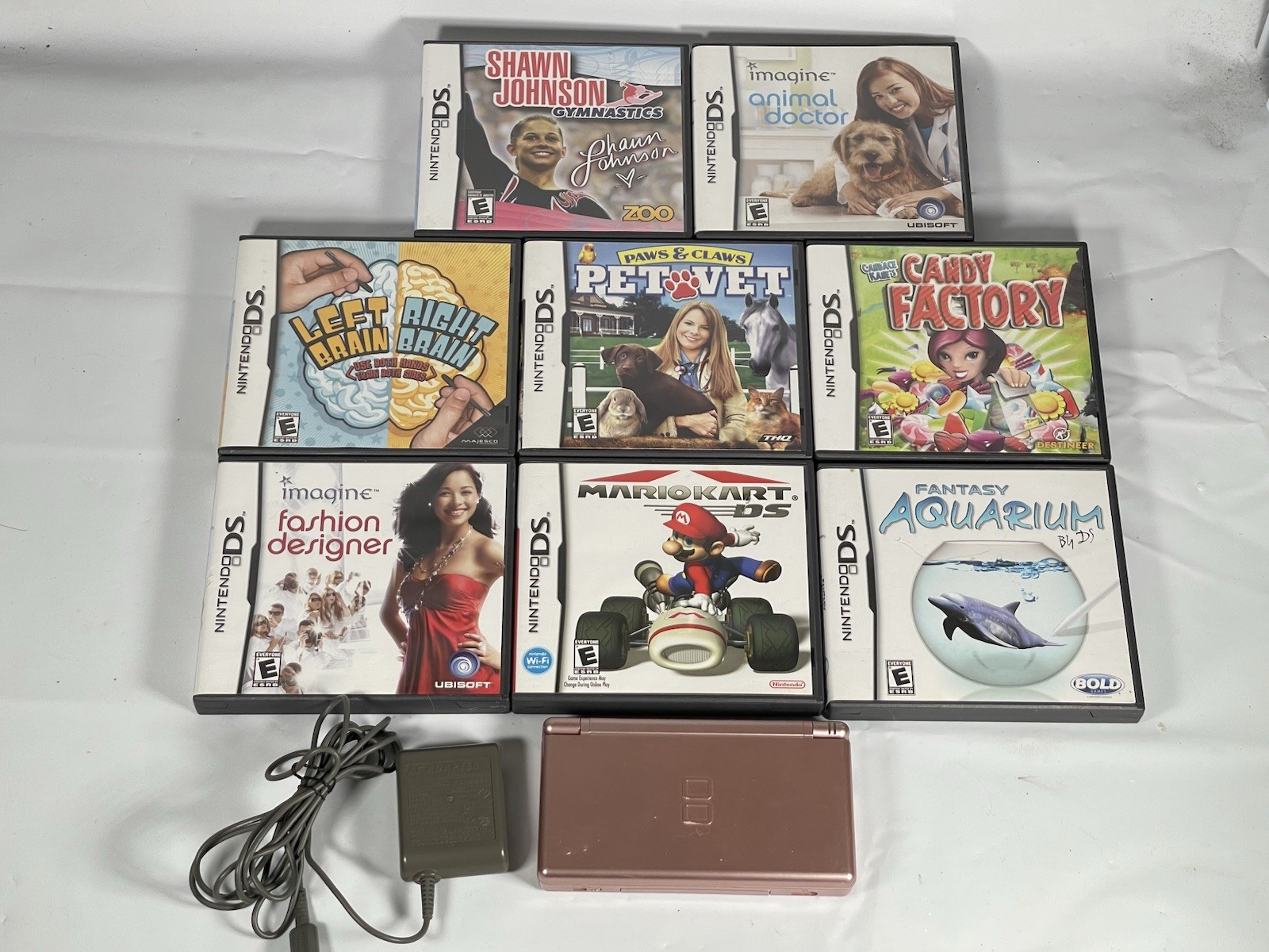Nintendo DS Lite Metallic Rose Pink Handheld Console with Games