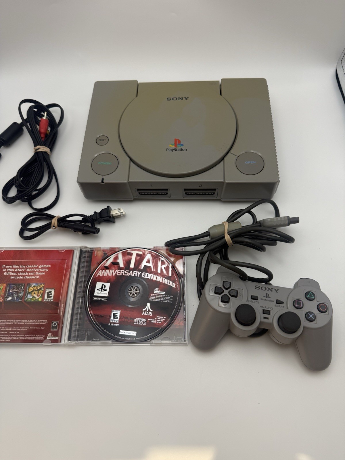 Sony PlayStation 1 PS1 Console Bundle with Oem DualShock Controller, And Game
