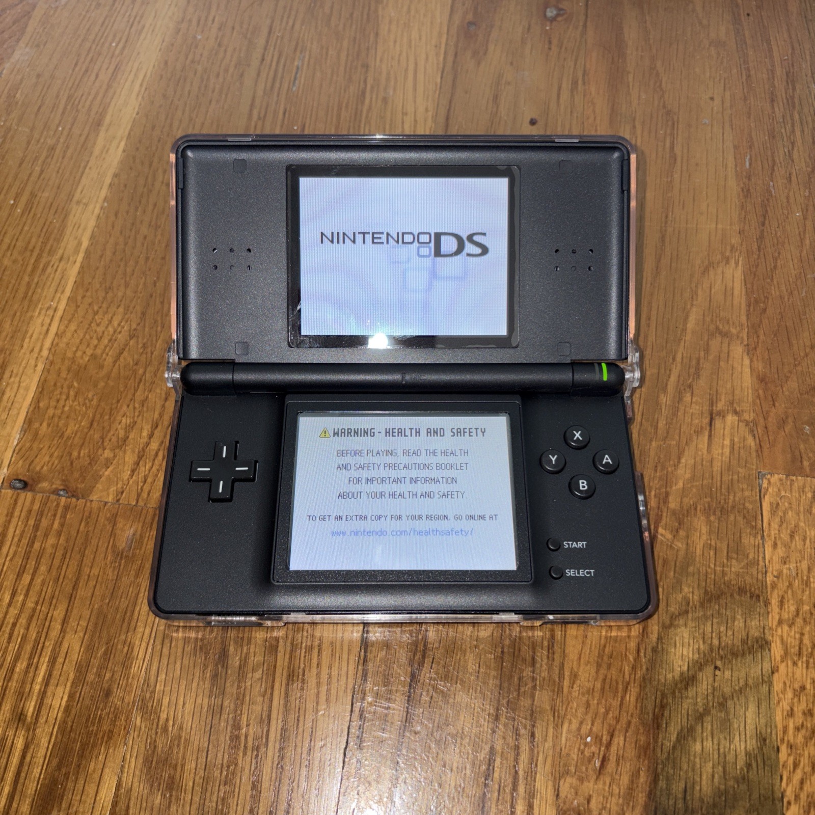 Nintendo DS Lite Console Black with charger case and four games model USG-001