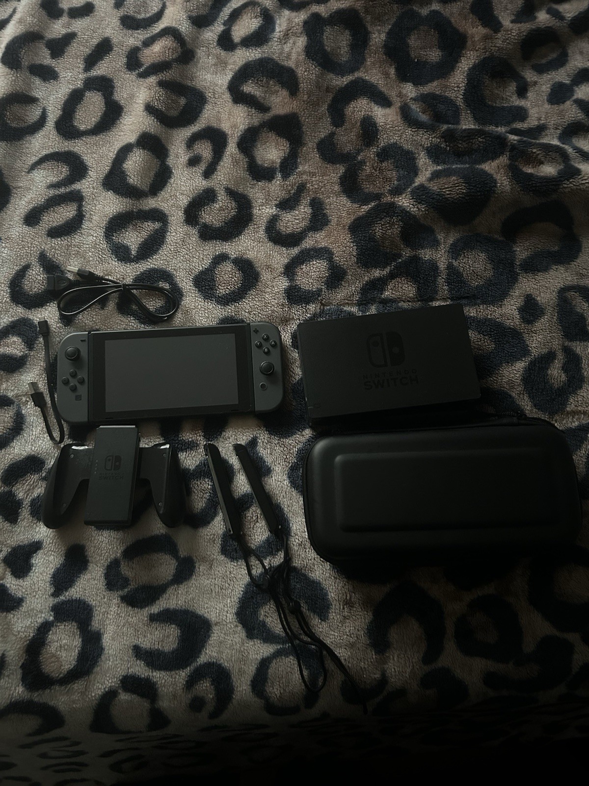 Black nintendo switch with grey joycons