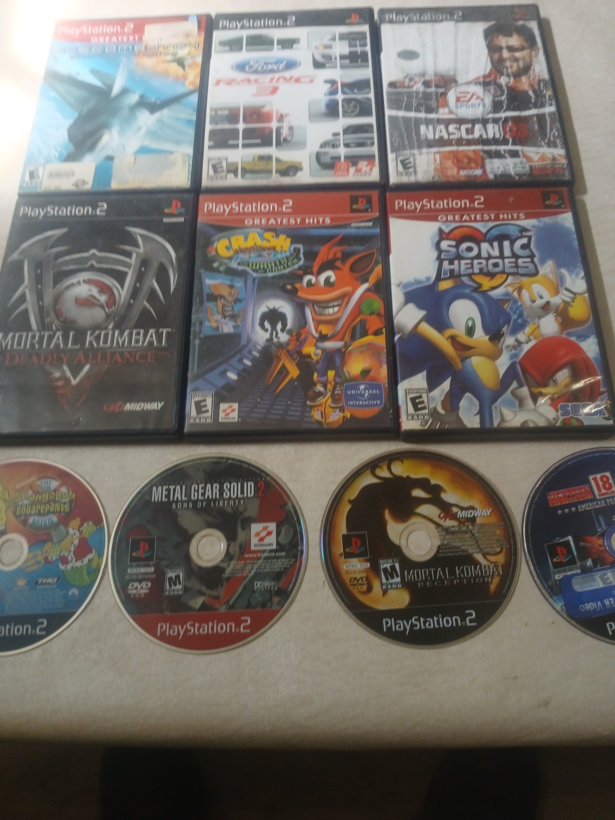 Playstation 2 Fat Console With Accessories and 20 Games.