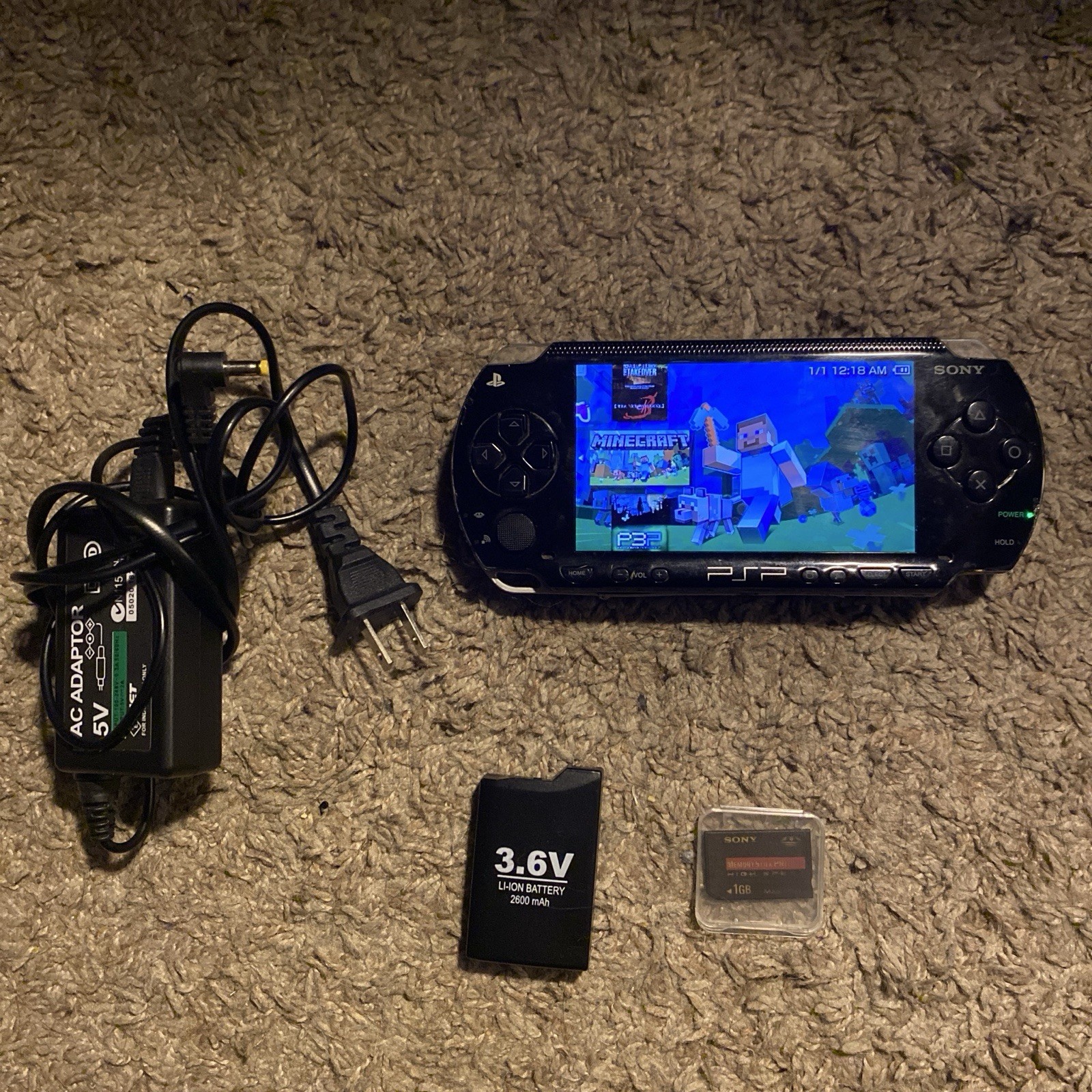 Sony PSP-1001 Black Handheld Console 128GB Wi-Fi with Charger