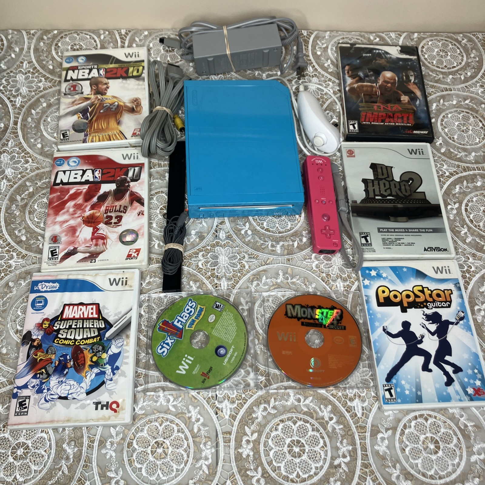 Nintendo Wii Bundle -Blue Console (Tested Works), Pink Remote, Nunchuck, 8 Games