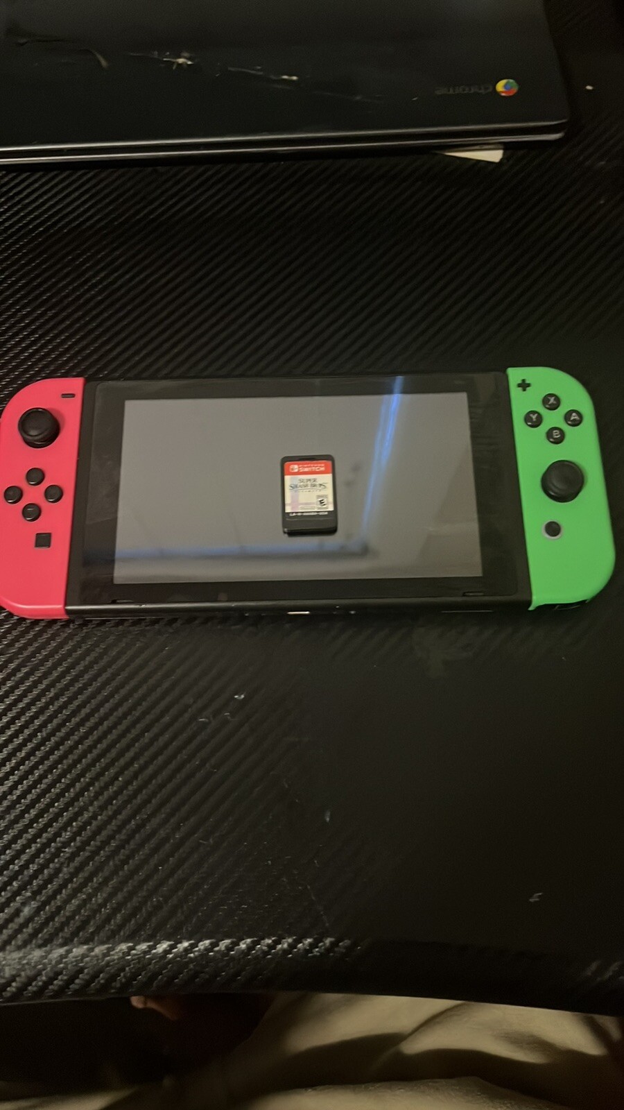 Nintendo Switch Handheld Console – Neon Green/pink Joy-Con + Super Smash Bros