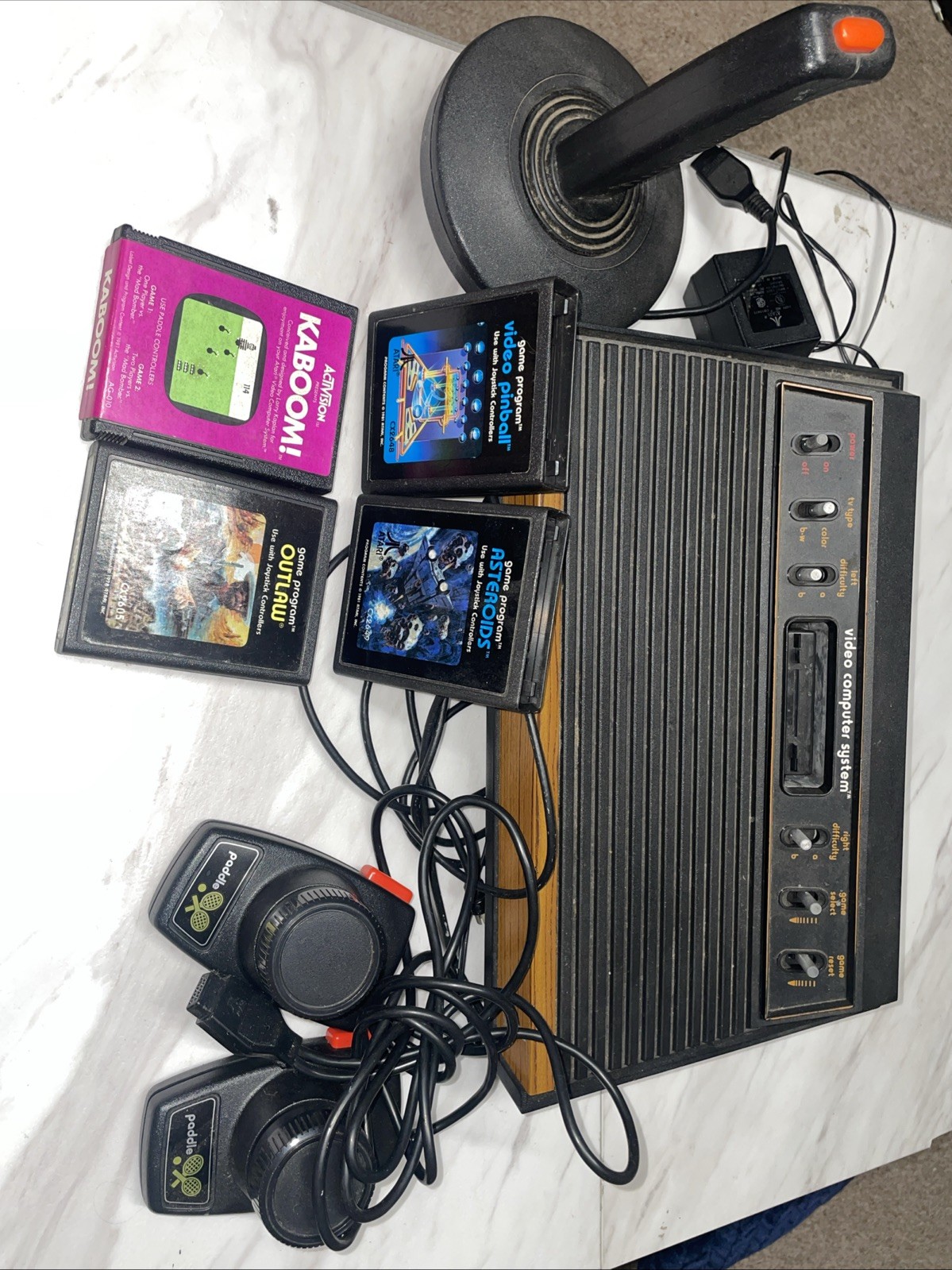 Atari 2600 Bundle with Console, 4 Games, Joystick, Paddles and Coax Adapter.