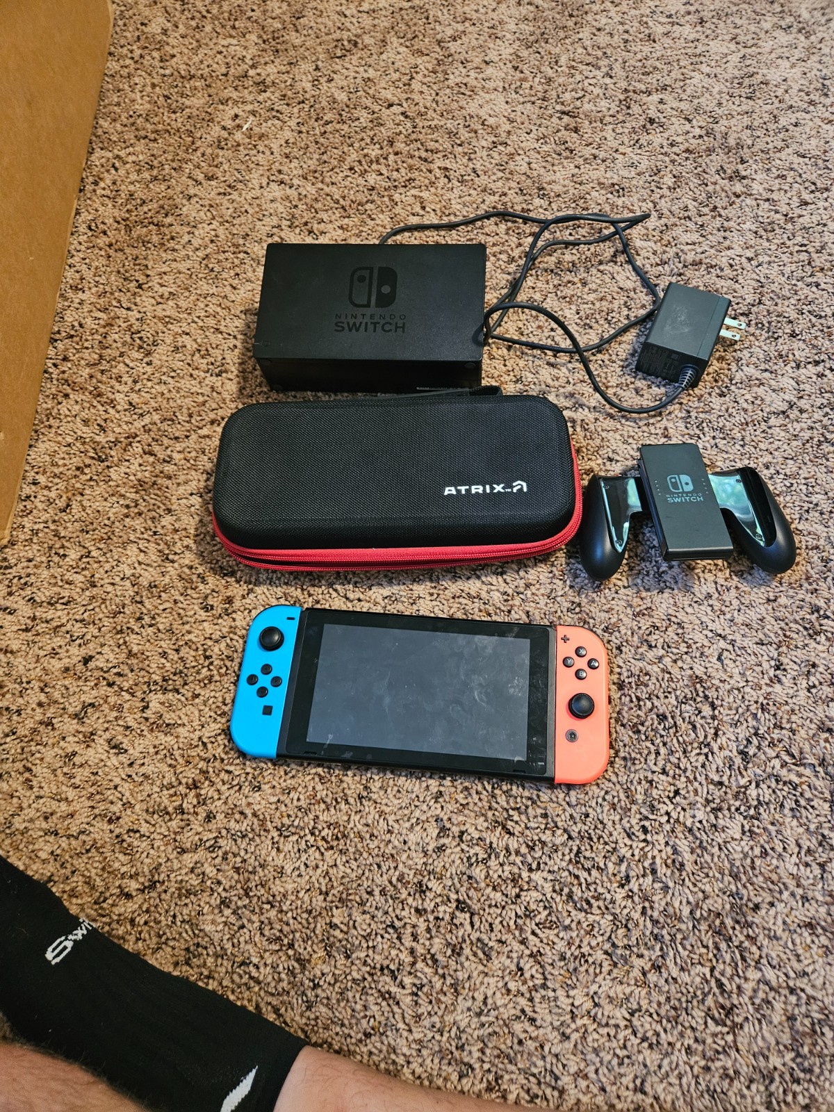 Nintendo Switch with Neon Blue and Neon Red Joy-Con and case
