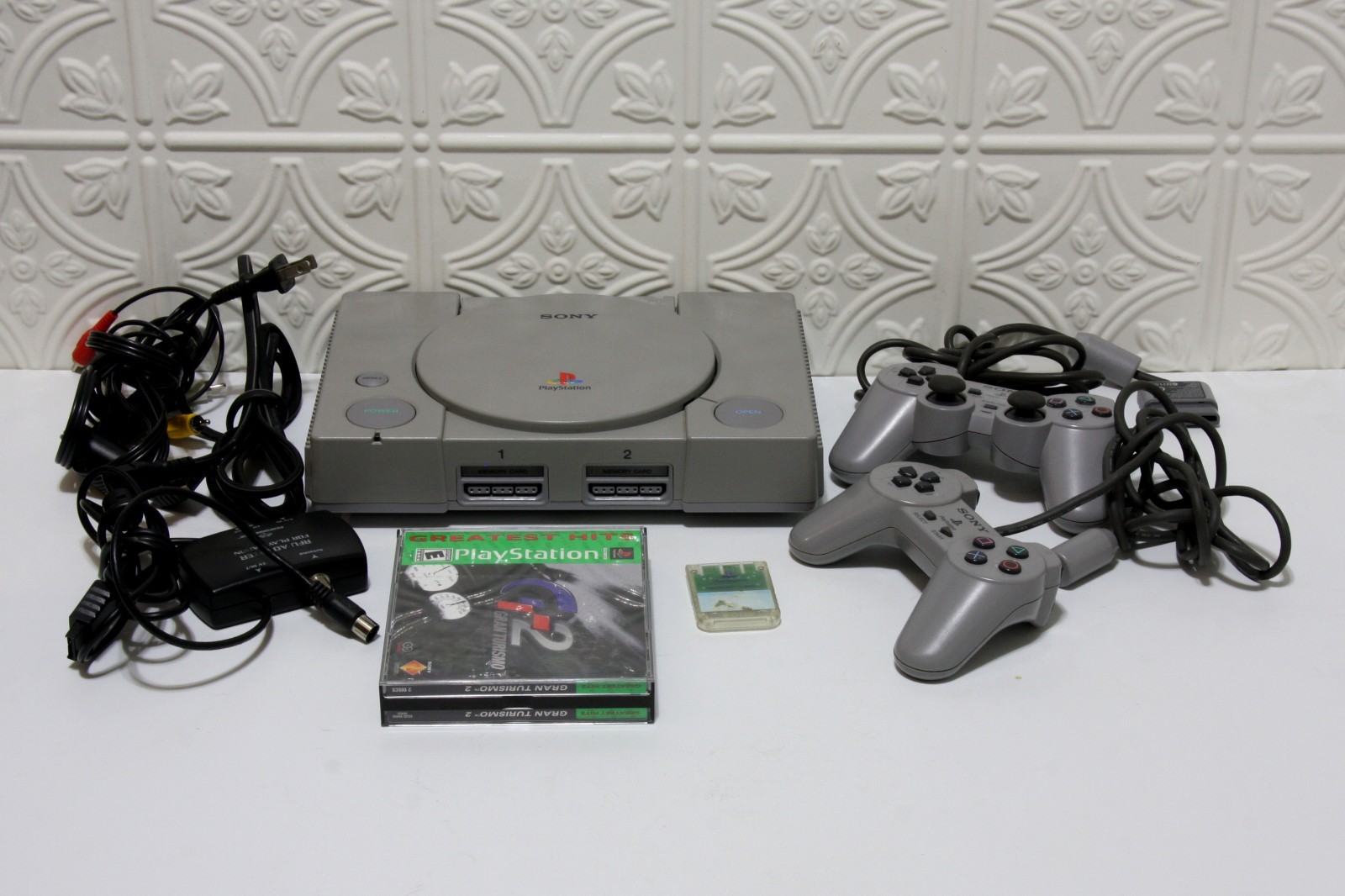 Playstation Console Original Bundle 2 Controllers, Cords, 1 Game, & Memory Card
