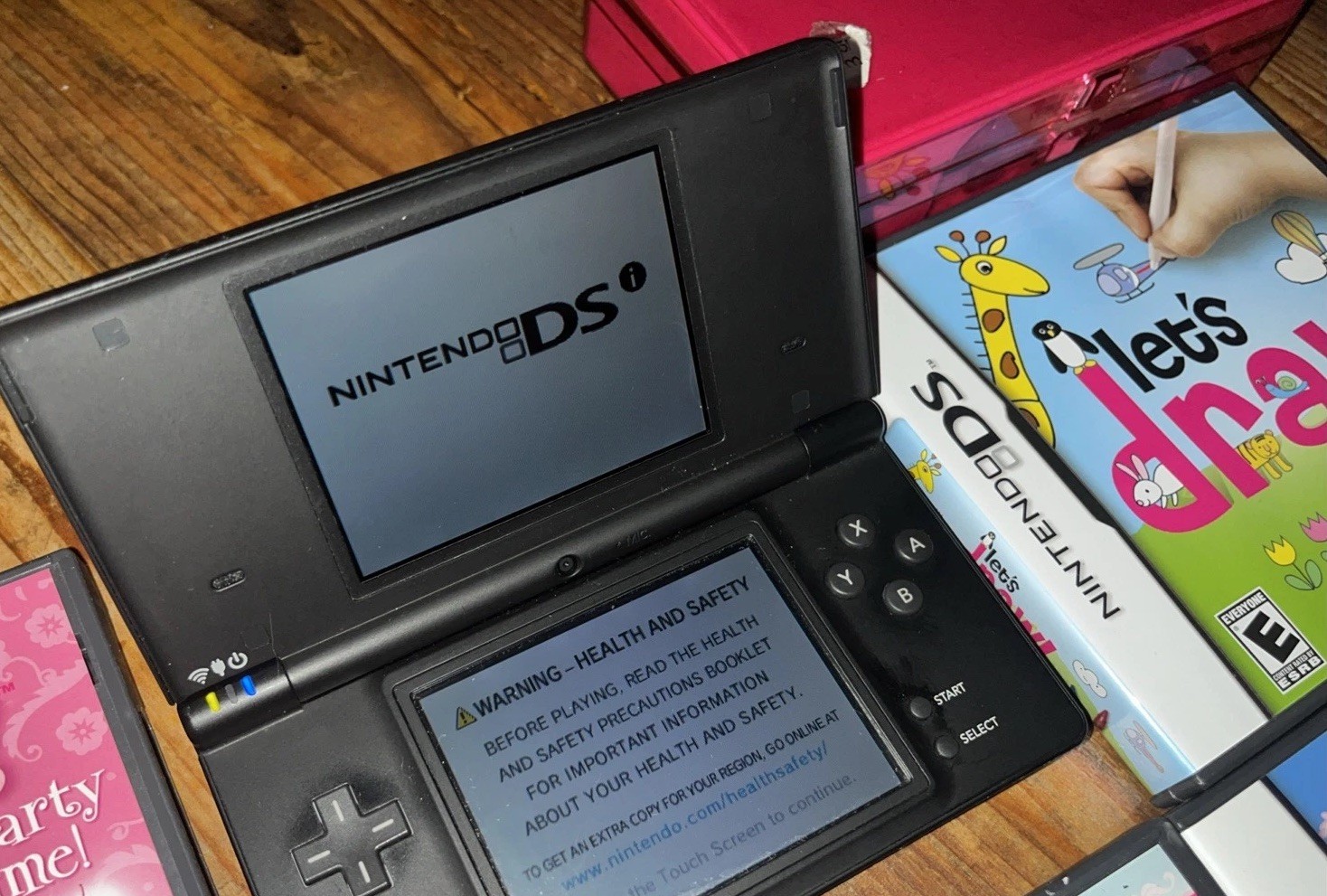 Nintendo DSi (TWL-001) 2008 Black Bundle w/ 5 Games & Carrying Case