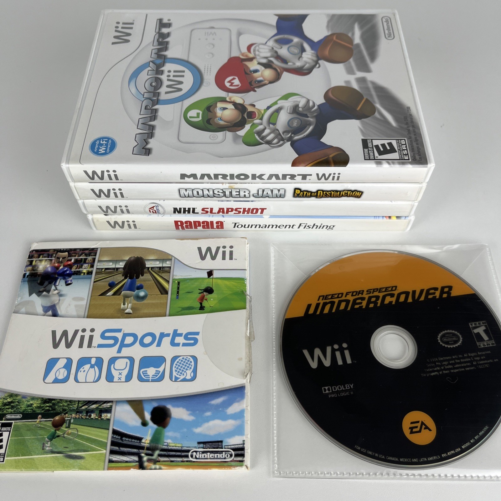 Nintendo Wii Console Bundle: Controller, Wheel + 6 Games Mario Kart, Monster Jam