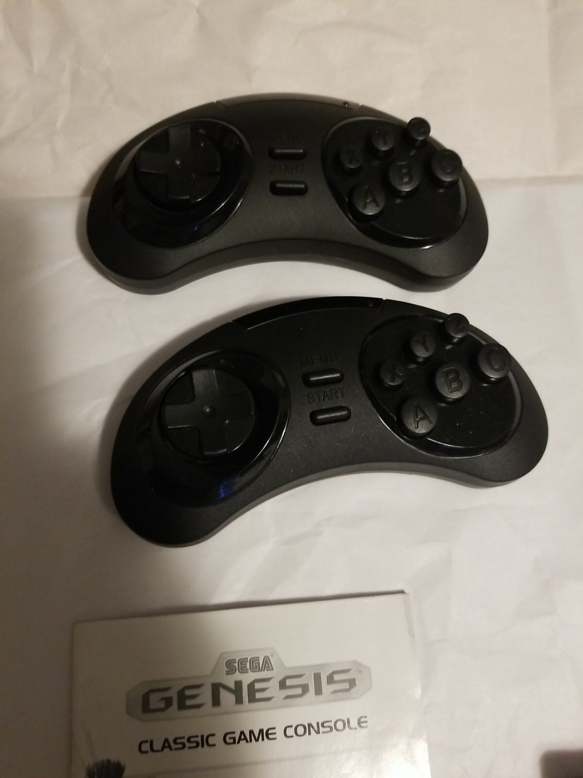 At Games Sega Genesis Classic Console With 2 controller and 40 games Built in.