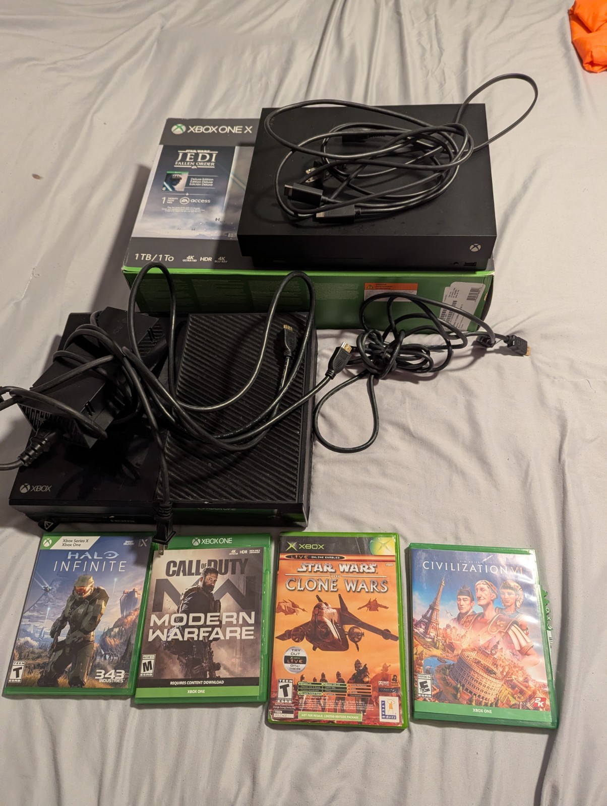 There Is A Xbox One And A Xbox 1 X They Both Have HDMI And Power Cable.