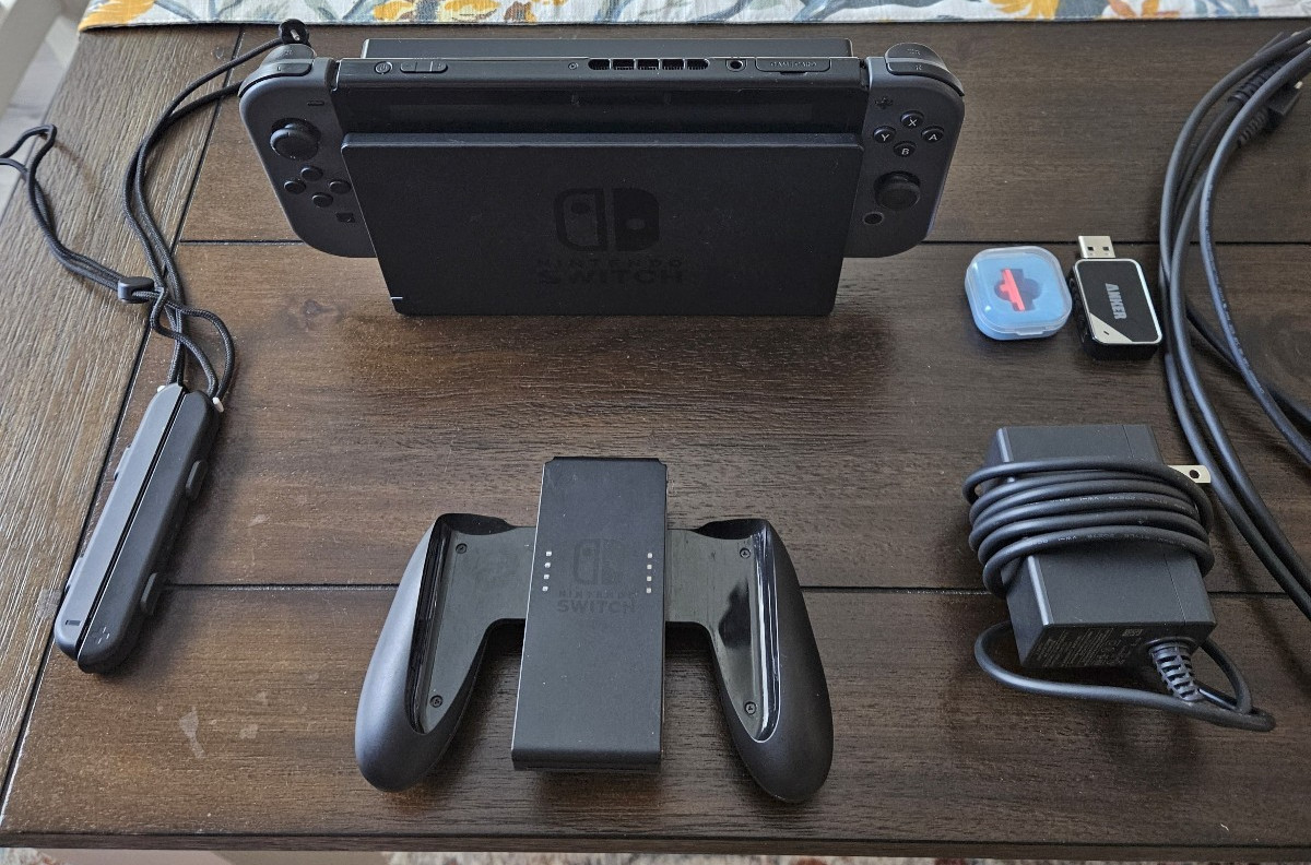 Nintendo Switch with Joycons, 256 micro SD, HDMI Cable, Dock, and power cable.