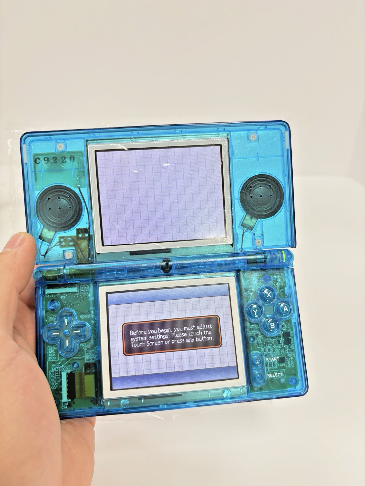 Refurbished Nintendo DS Lite Handheld – Transparent Blue – New Shell