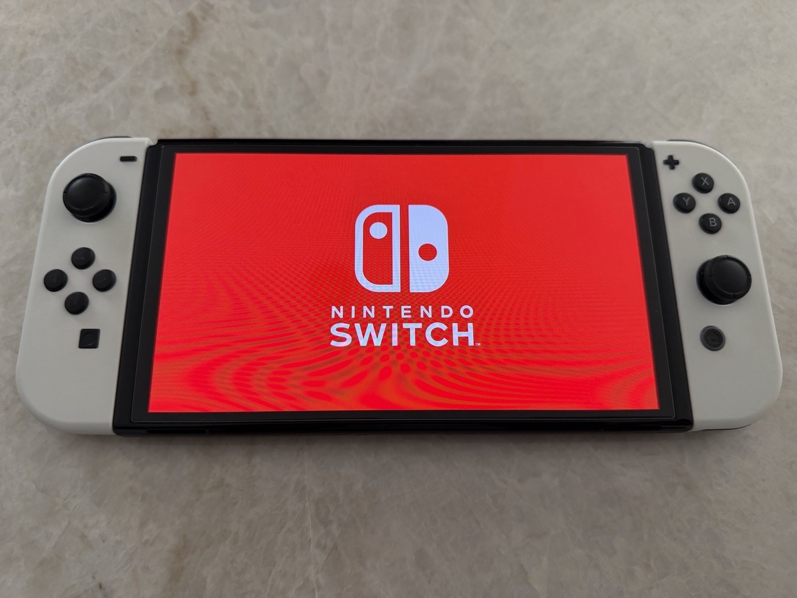 Bundle – Nintendo Switch OLED 64GB White Joy-Con w/ Extra Grip and Hard Case