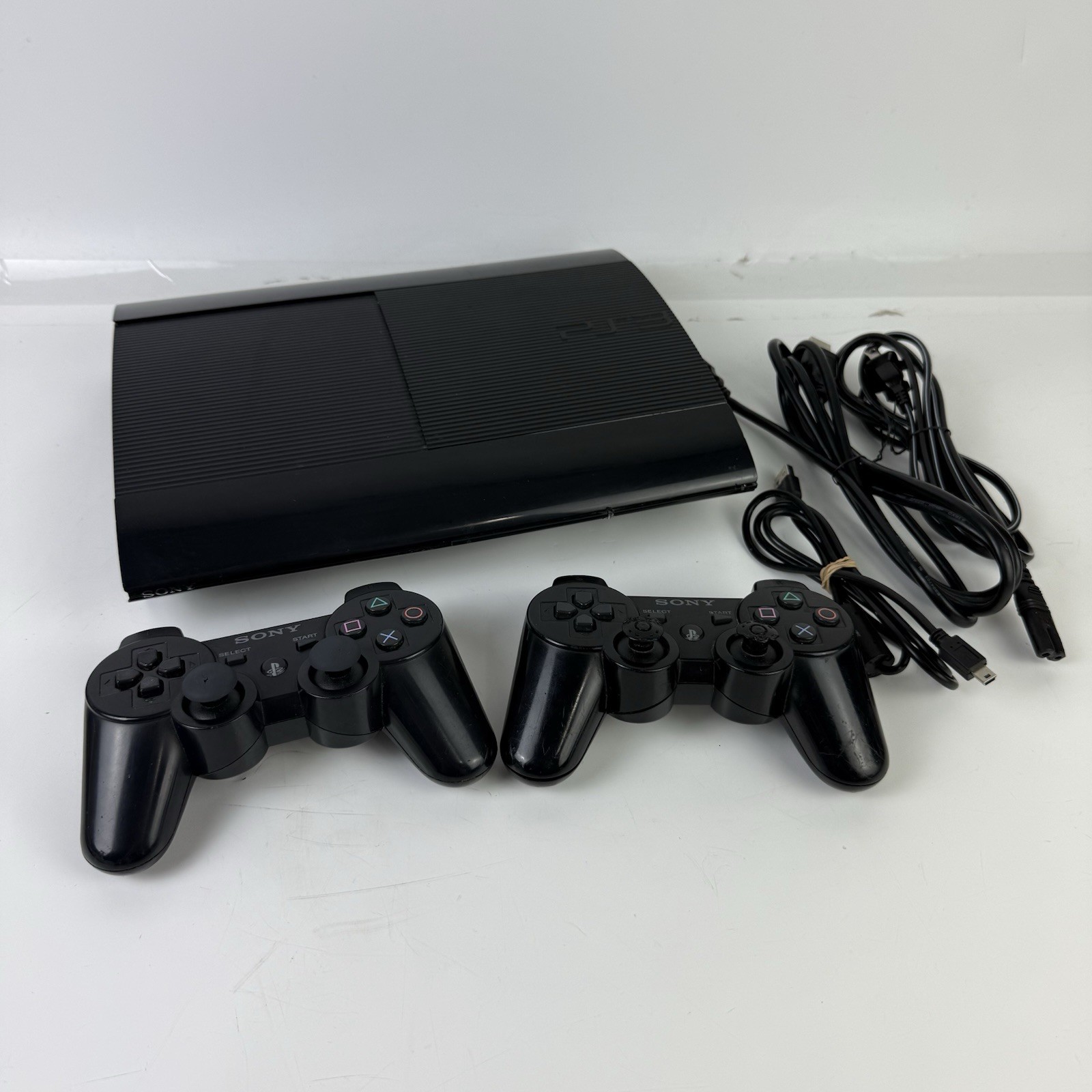 Sony PlayStation 3 PS3 Super Slim Console (CECH-4201A) 12GB w/ 2 Controllers