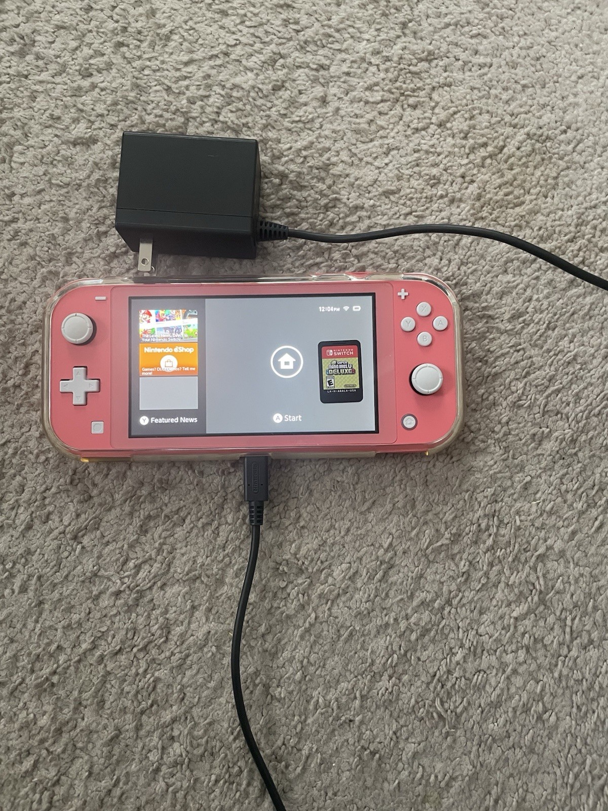 Coral Nintendo Switch Lite. Case, game and charger included.
