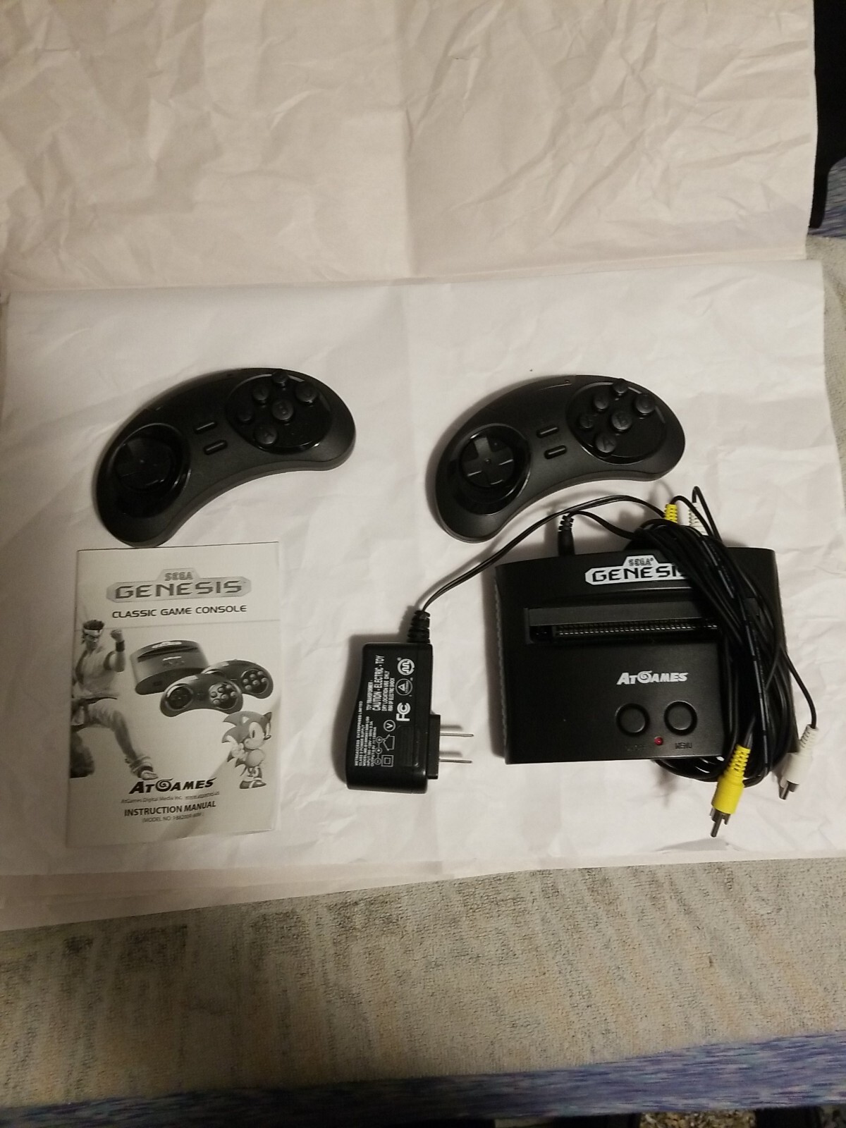 At Games Sega Genesis Classic Console With 2 controller and 40 games Built in.