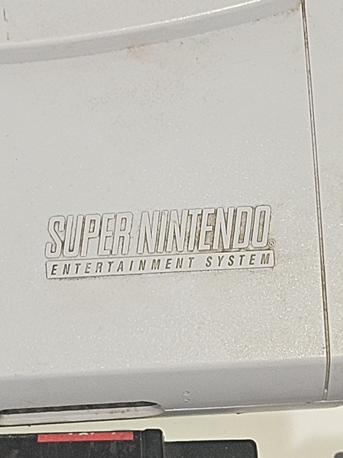 Super Nintendo SNES JR Console with 8 games, cords, and 1 controller