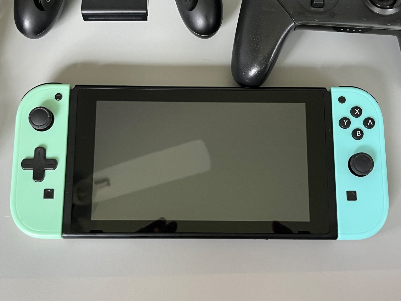 Nintendo Switch Bundle w Pastel Green Blue Joycon 2 controllers 2 games Case