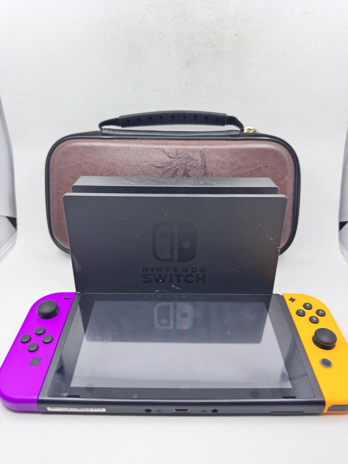 Nintendo Switch 32GB Console with Orange and Purple Joy-Con [w/ Dock & Case]