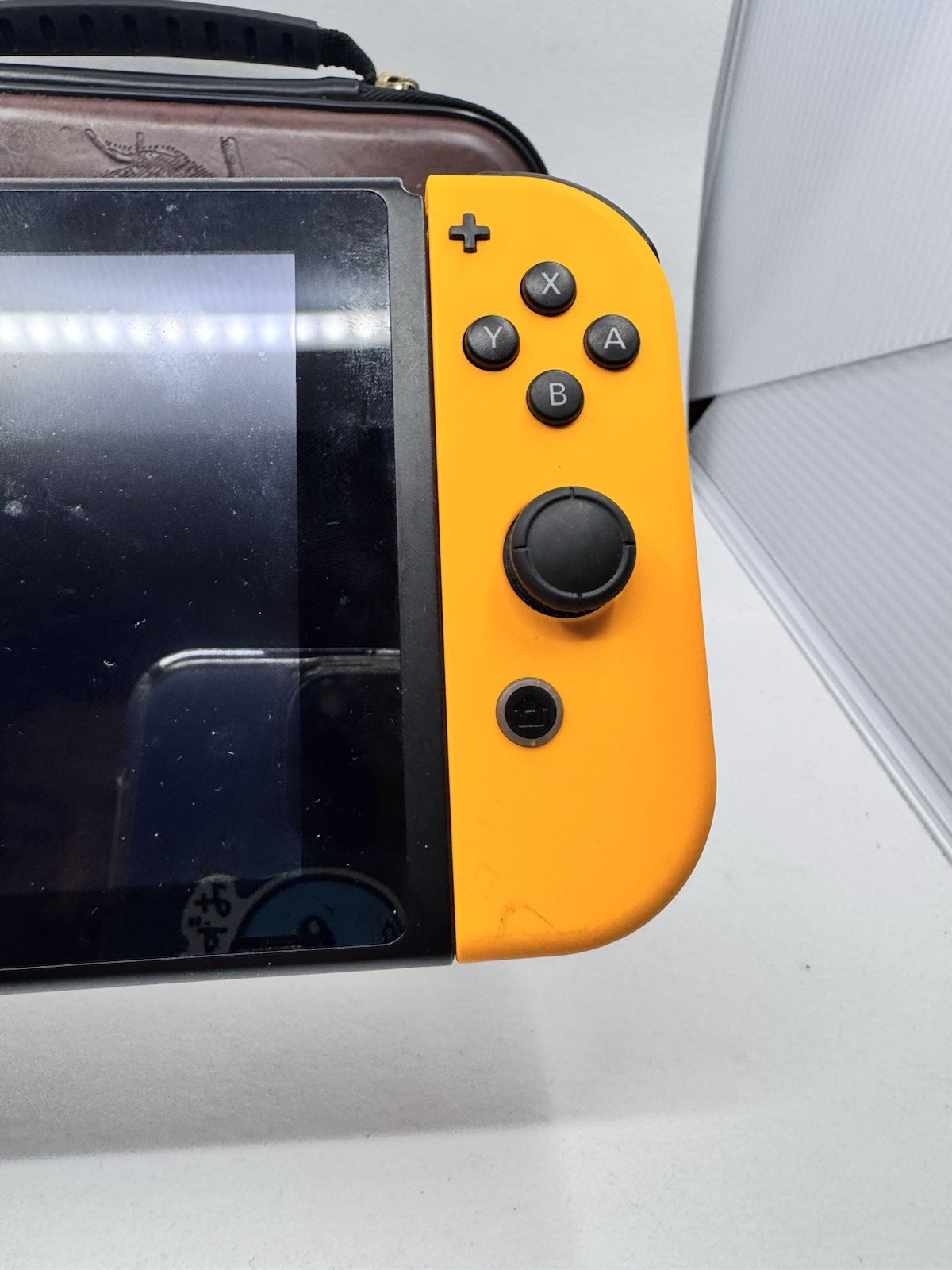 Nintendo Switch 32GB Console with Orange and Purple Joy-Con [w/ Dock & Case]