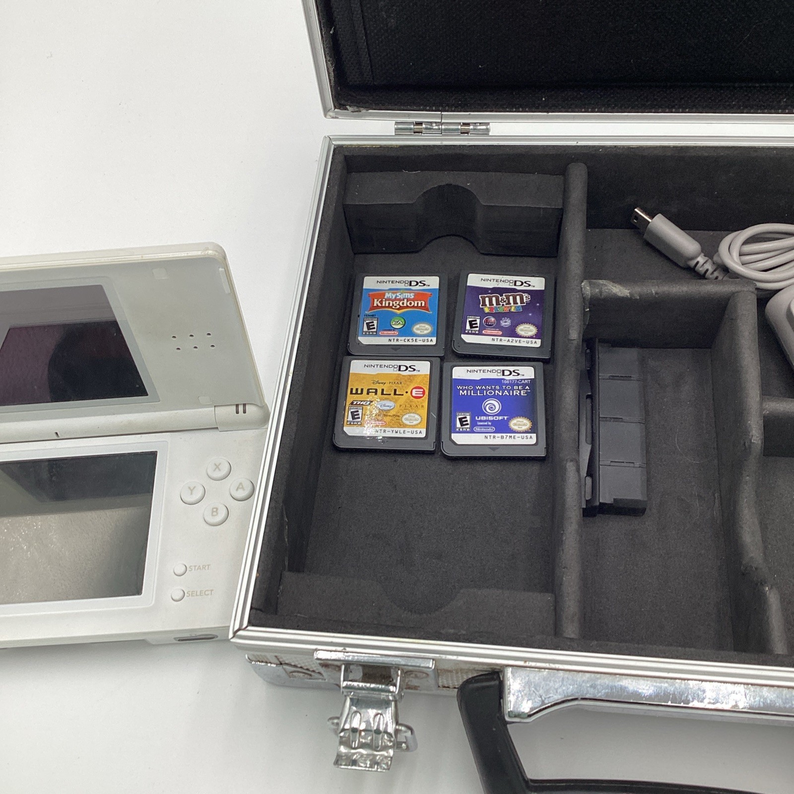 Nintendo DS Lite Lot Complete With Four Games, Charger, Stylus And A Metal Case