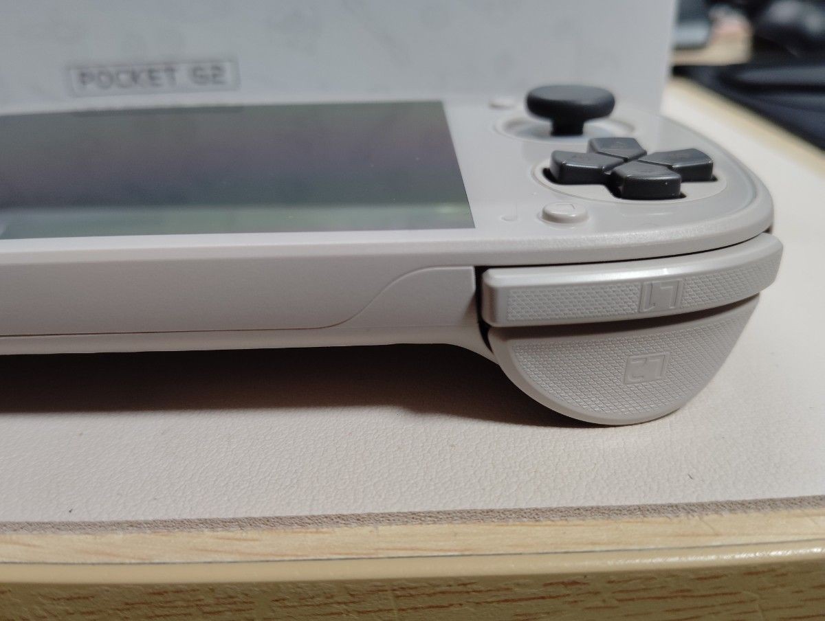 Retroid Pocket G2 handheld game console, 16-bit color, used, TPU case included.