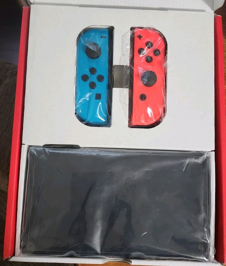 Blue and Red Nintendo Switch OLED – comes wirh 128gb SD card