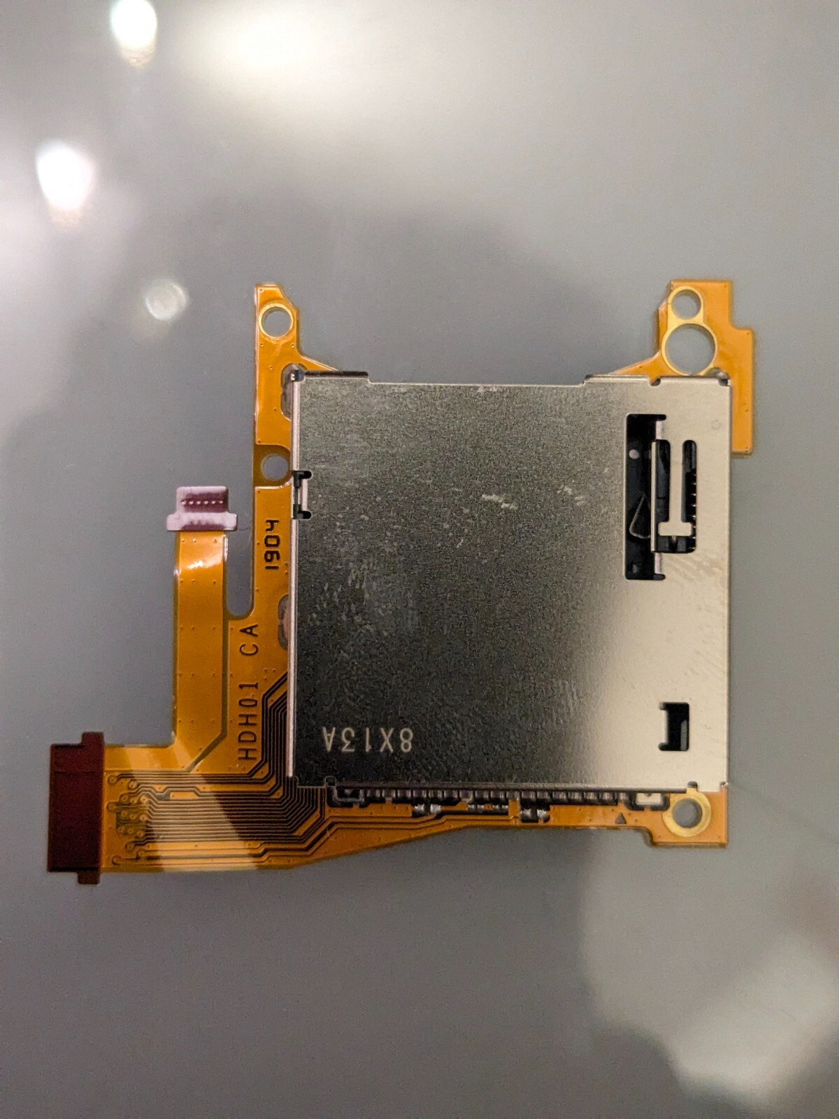 Nintendo Switch Lite game card reader and headphone jack