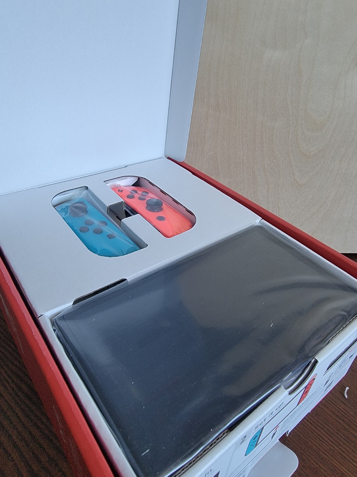 NEW IN BOX Nintendo Switch OLED Console – 64GB – Neon Blue/Neon Red Joycons