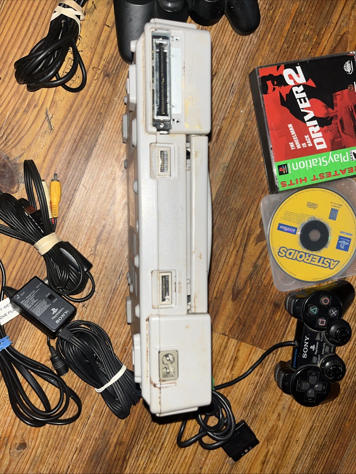 Sony Playstation 1 Gray Console With Games Controllers, A/V Cable, and Power