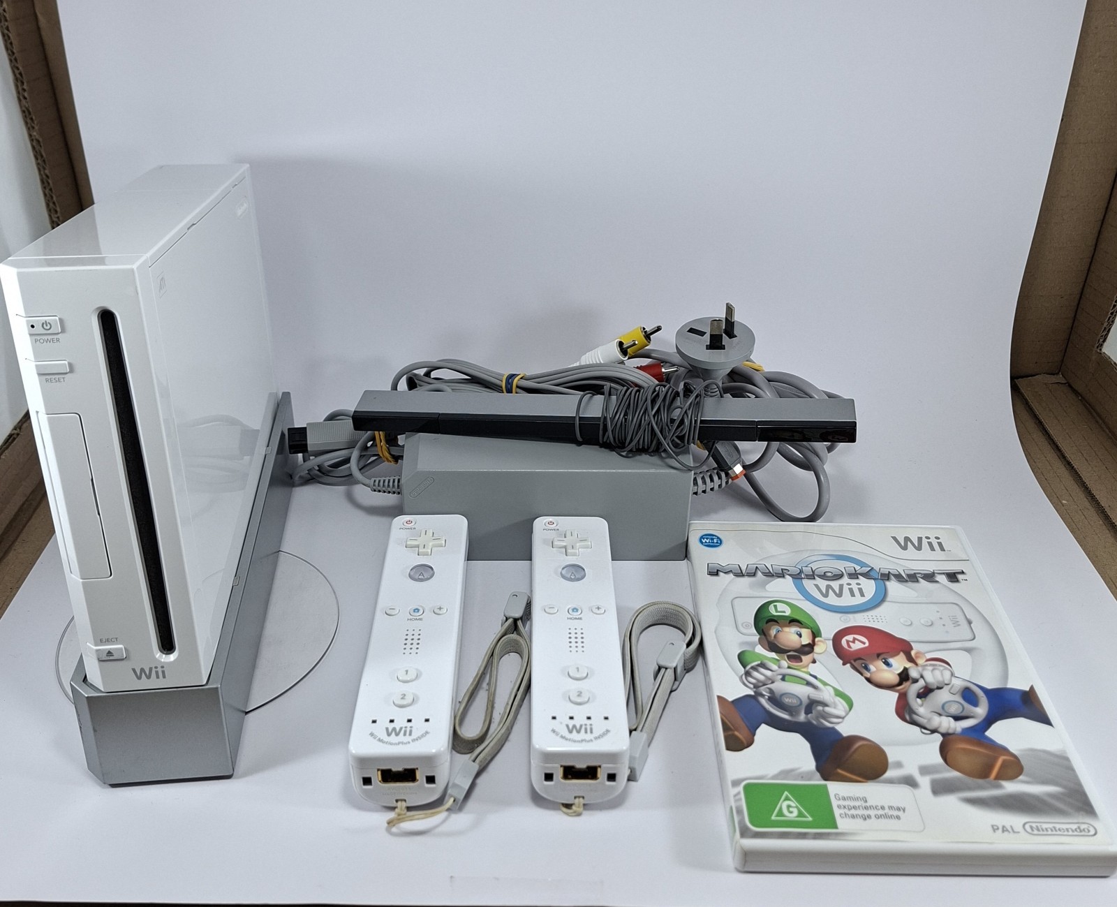 Nintendo Wii Console RVL-001 Bundle – x2 Official Wii Remote Motion Plus, Game