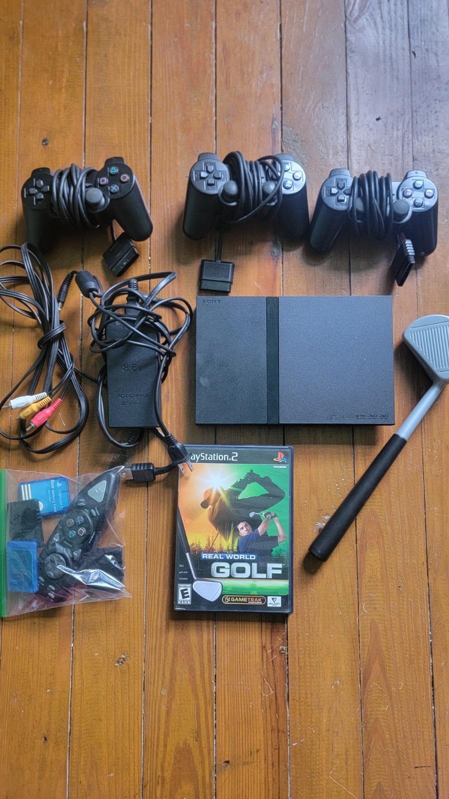 PS2 SLIM CONSOLE AND CONTROLLER BUNDLE WITH REAL WORLD GOLF GAME