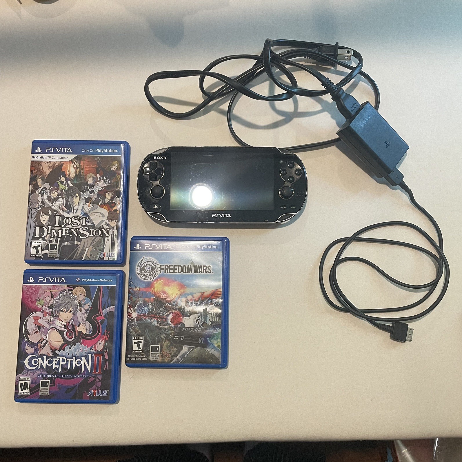 Sony PS Vita 1000 OLED Black Console Bundle-8GB Card, 3 CIB Games, OEM Charger