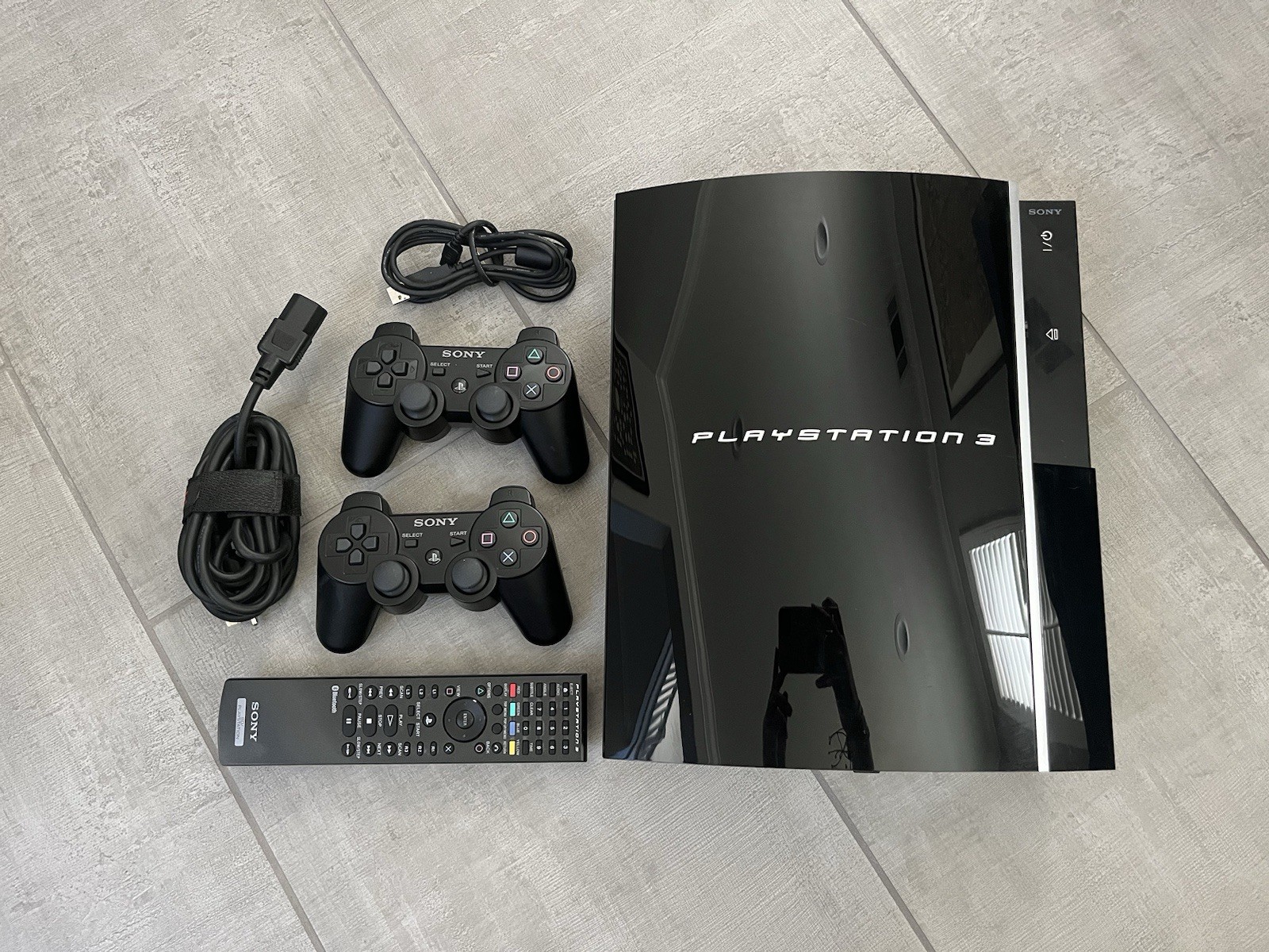 Sony PlayStation 3 Black Fat Includes 2 Controllers, Remote, And Cords- Tested