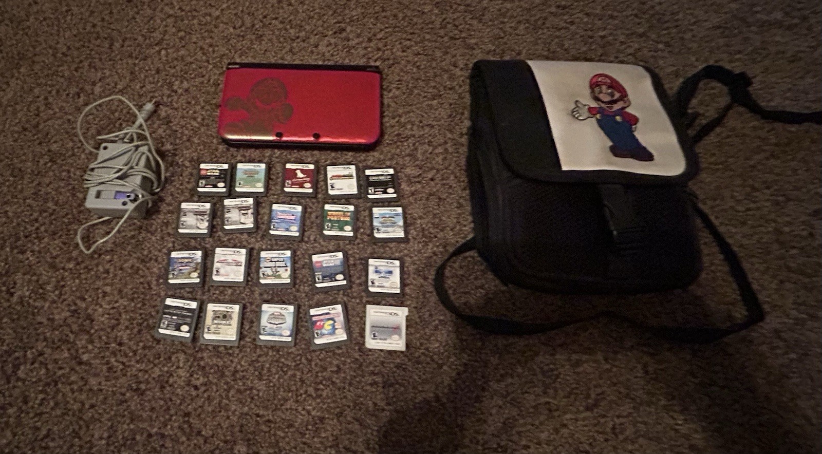 Nintendo 3DsXL with 20 Games, A Charger And Carrying Case