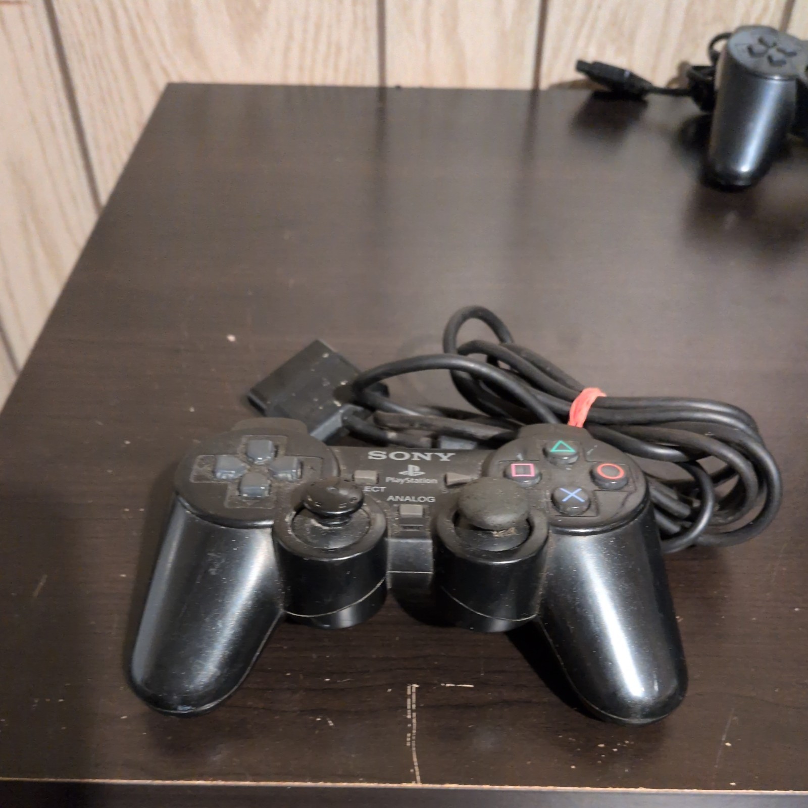 2 Sony PlayStation Consoles (w/Controllers, Cable, & 2 8MB Memory Cards)