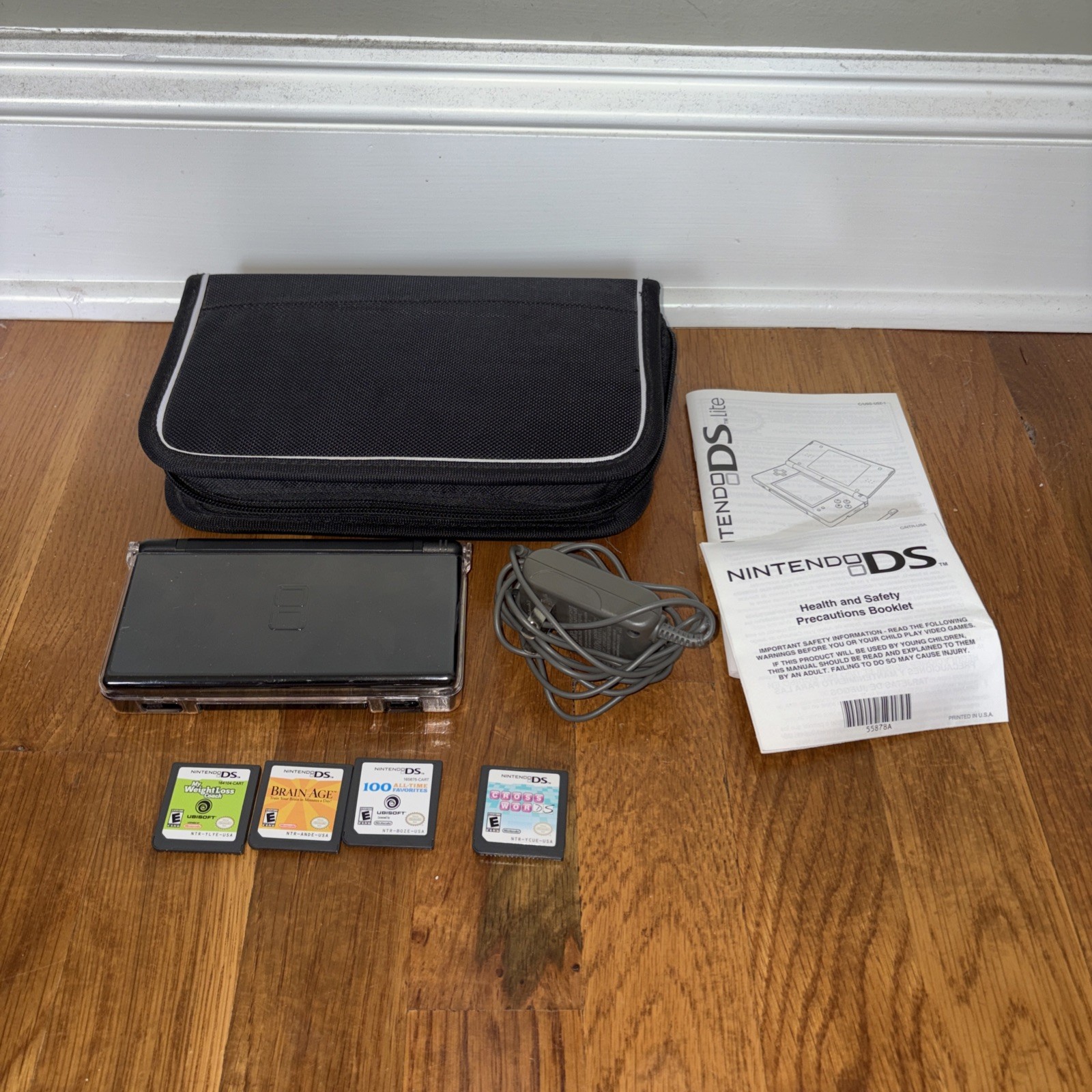 Nintendo DS Lite Console Black with charger case and four games model USG-001