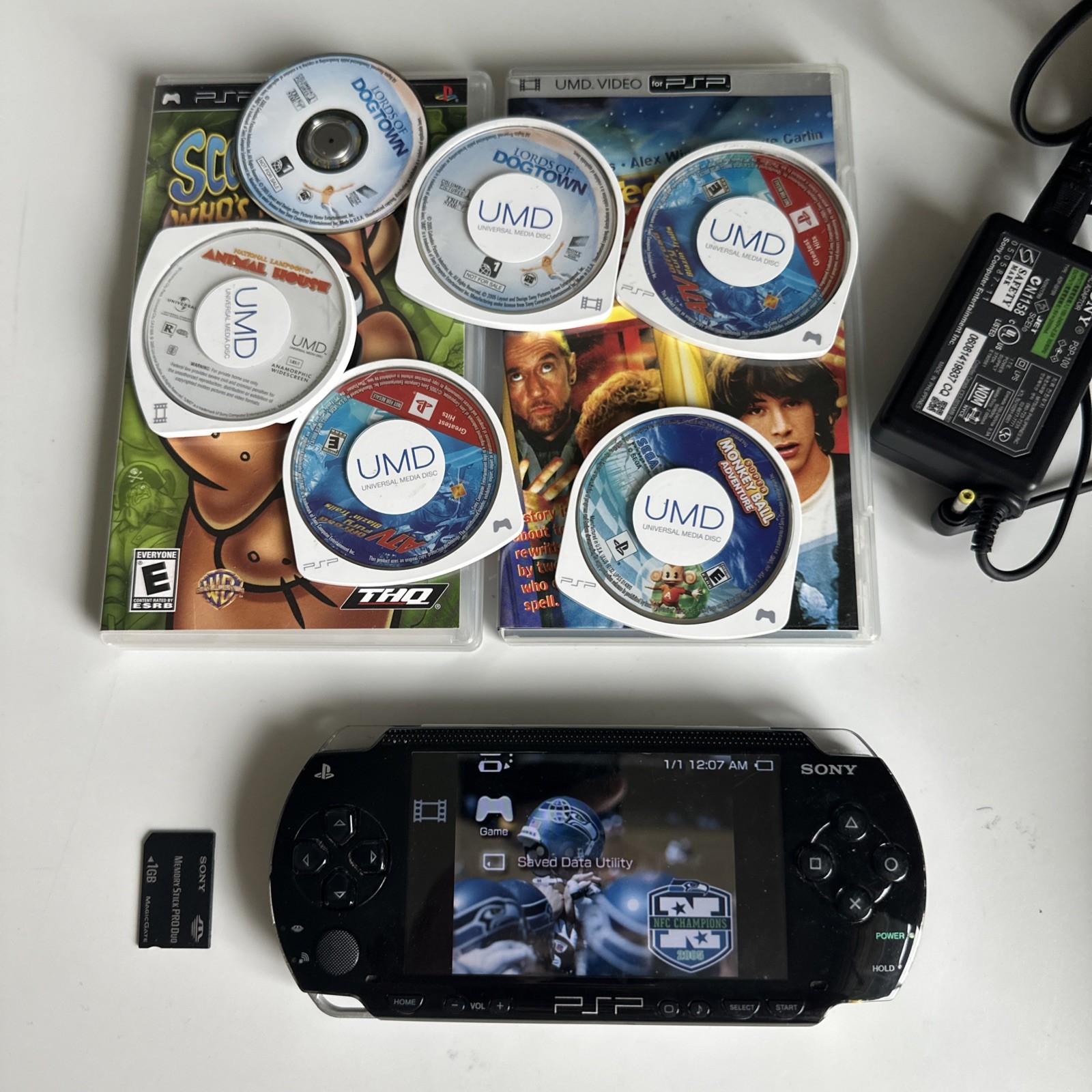 Sony PSP-1001 new Charger, 8discs, monkey ball, 1 gb memory tested