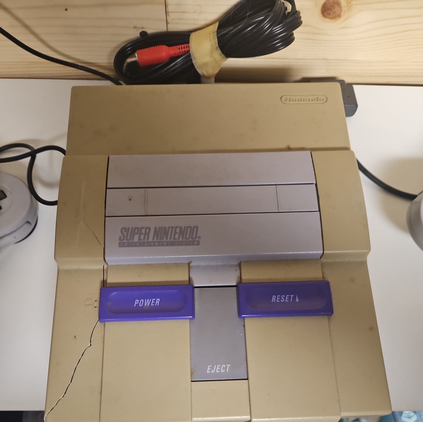 Super Nintendo Entertainment SNES with coords and two controllers working