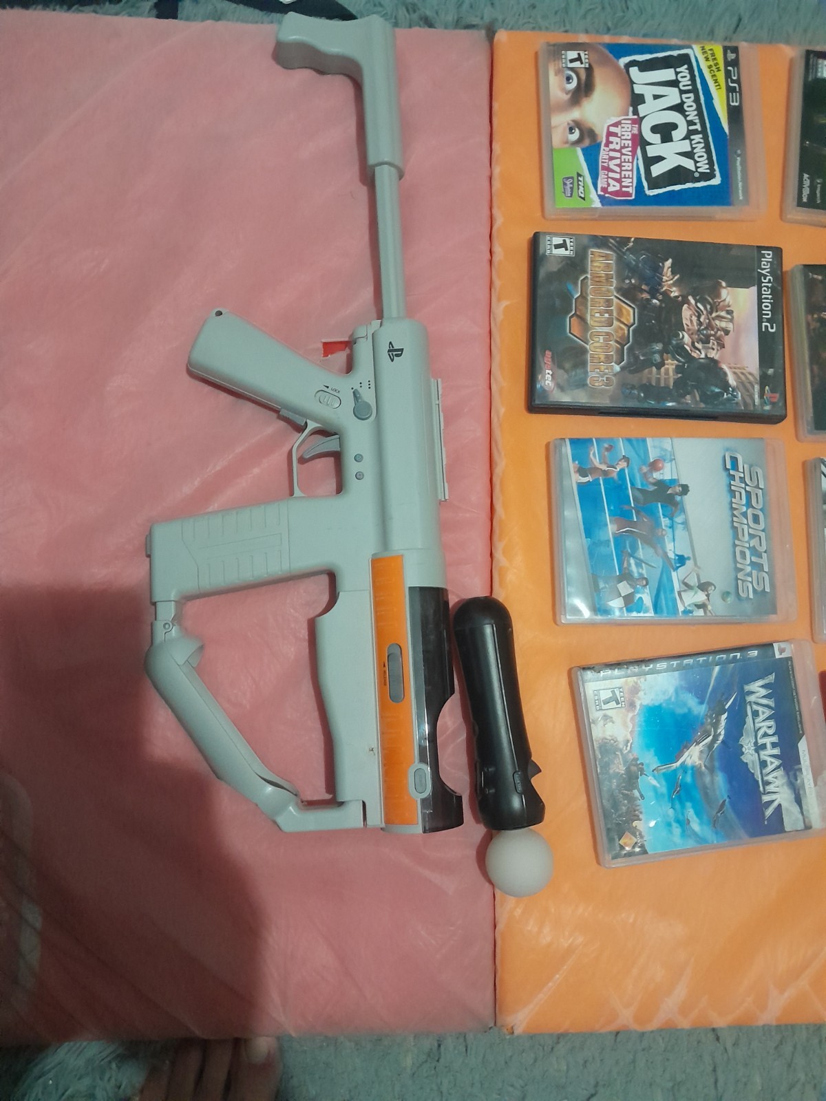 Sony PS3 Slim 320GB, 2 DS Controls/charger, MOVE Motion Gun/remote/cam, 8 Games