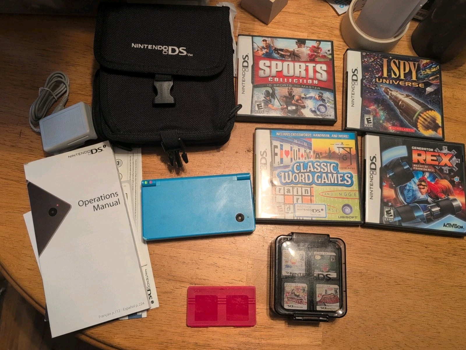 Blue Nintendo DSI With 14 Games, Charger, Manual And Case