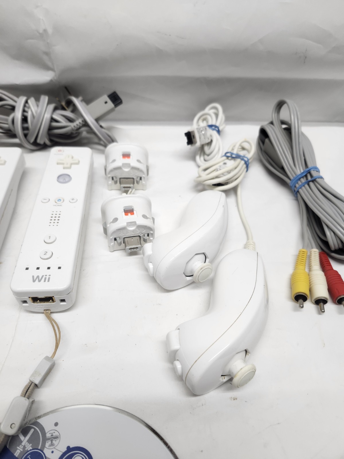 Nintendo Wii Console Bundle (2) Controllers, Motion Plus, Game Nunchuck, & Cords