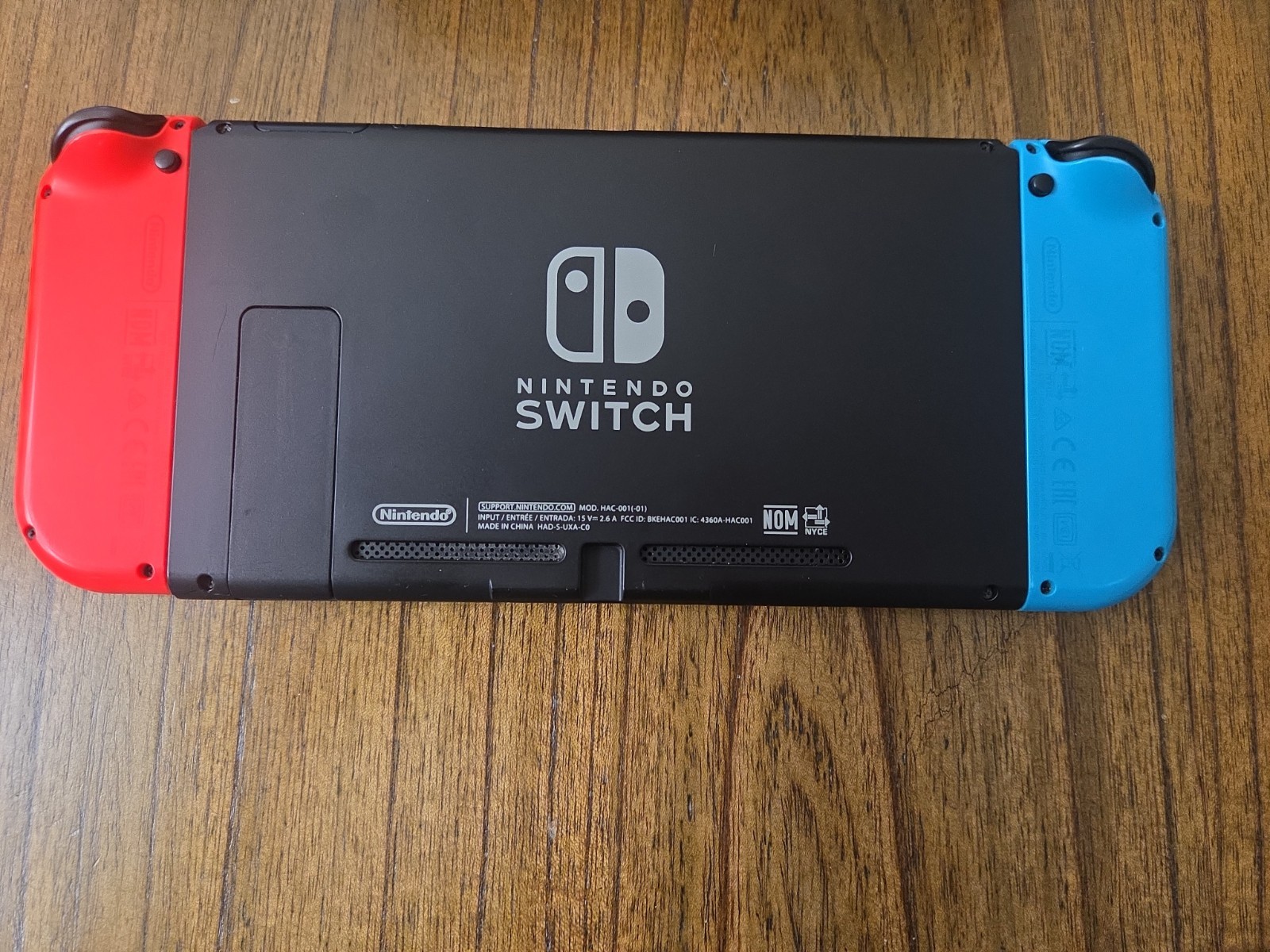 Nintendo Switch Console with Neon Red and Blue Joy-Cons, Plus Games
