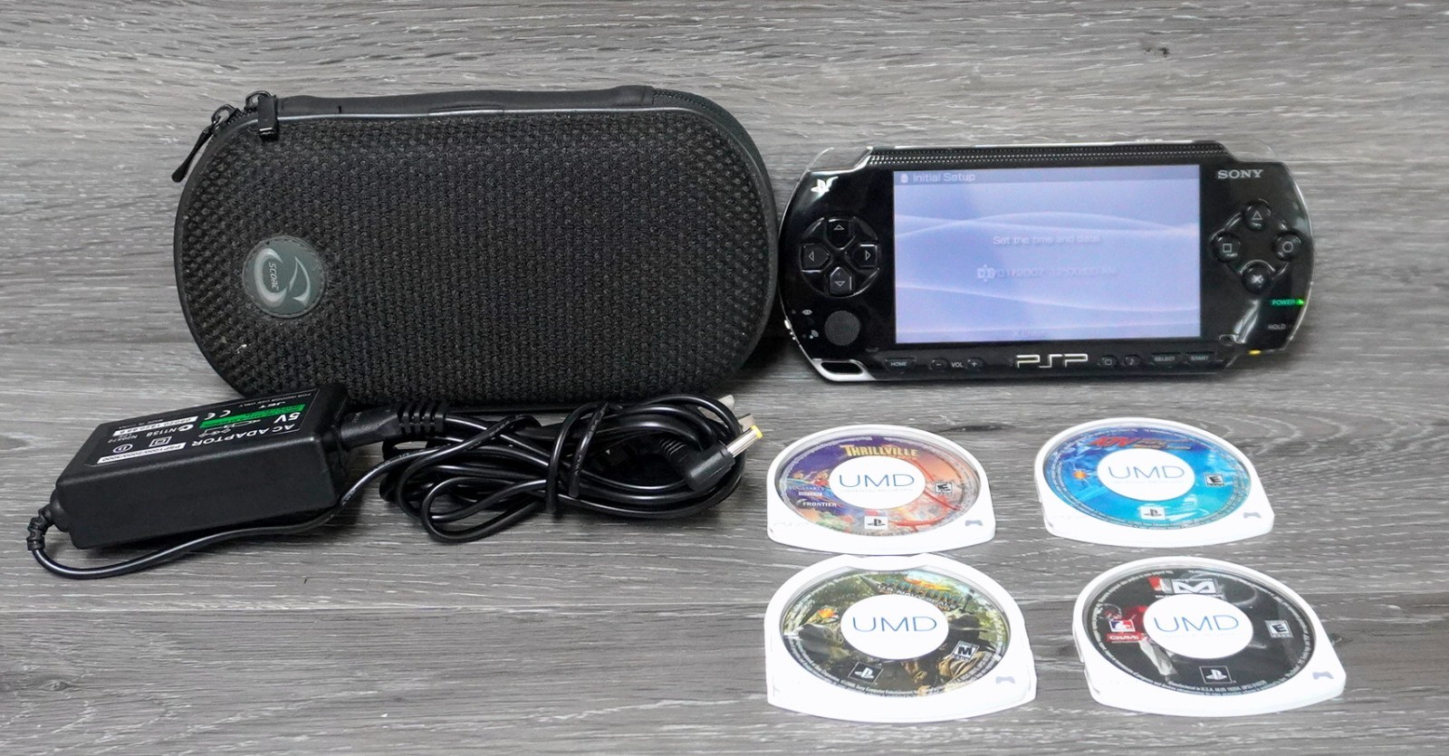 Sony PSP-1001 Black Handheld System Wi-Fi w/ Carrying Case & UMD Games