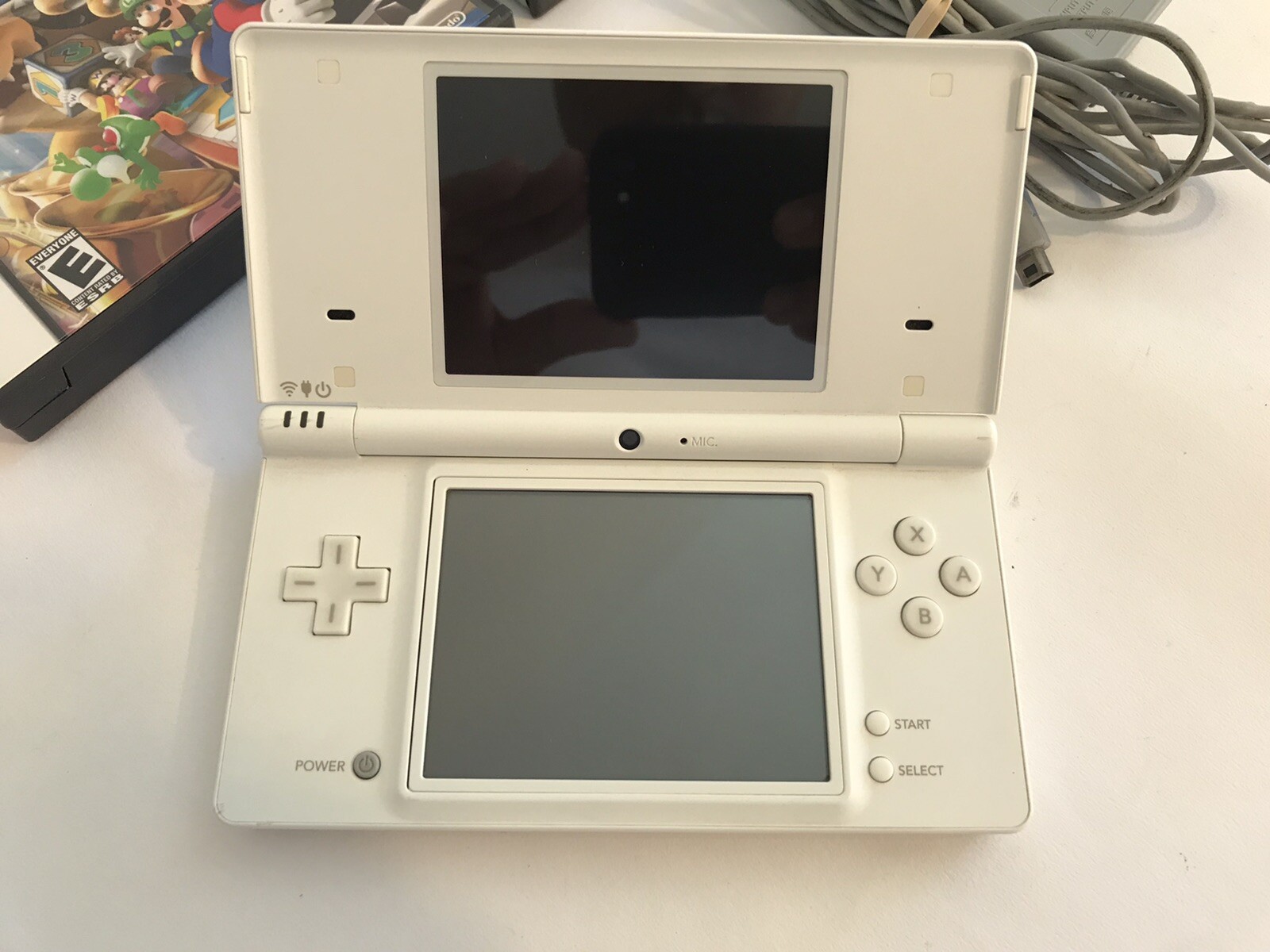 Nintendo DSi Handheld Game Console – White- with charger and 8 games