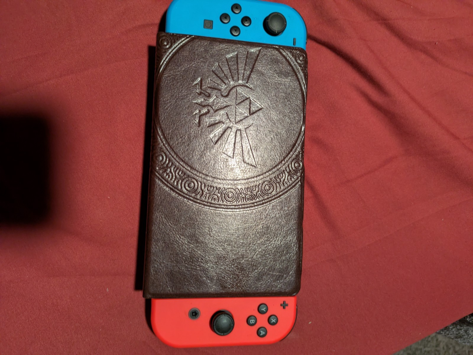 Nintendo Switch OLED Console with Red Blue Joy-Cons and Zelda Carry Case