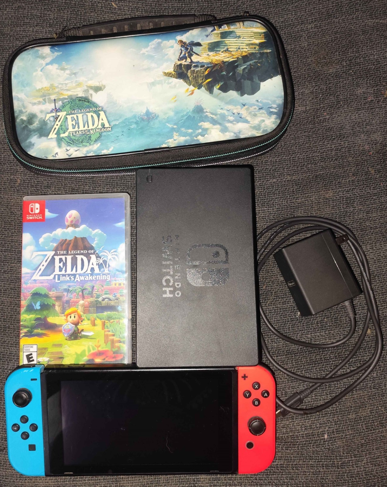 Nintendo Switch with Neon Red and Neon Blue Joy-Con with travel case and game