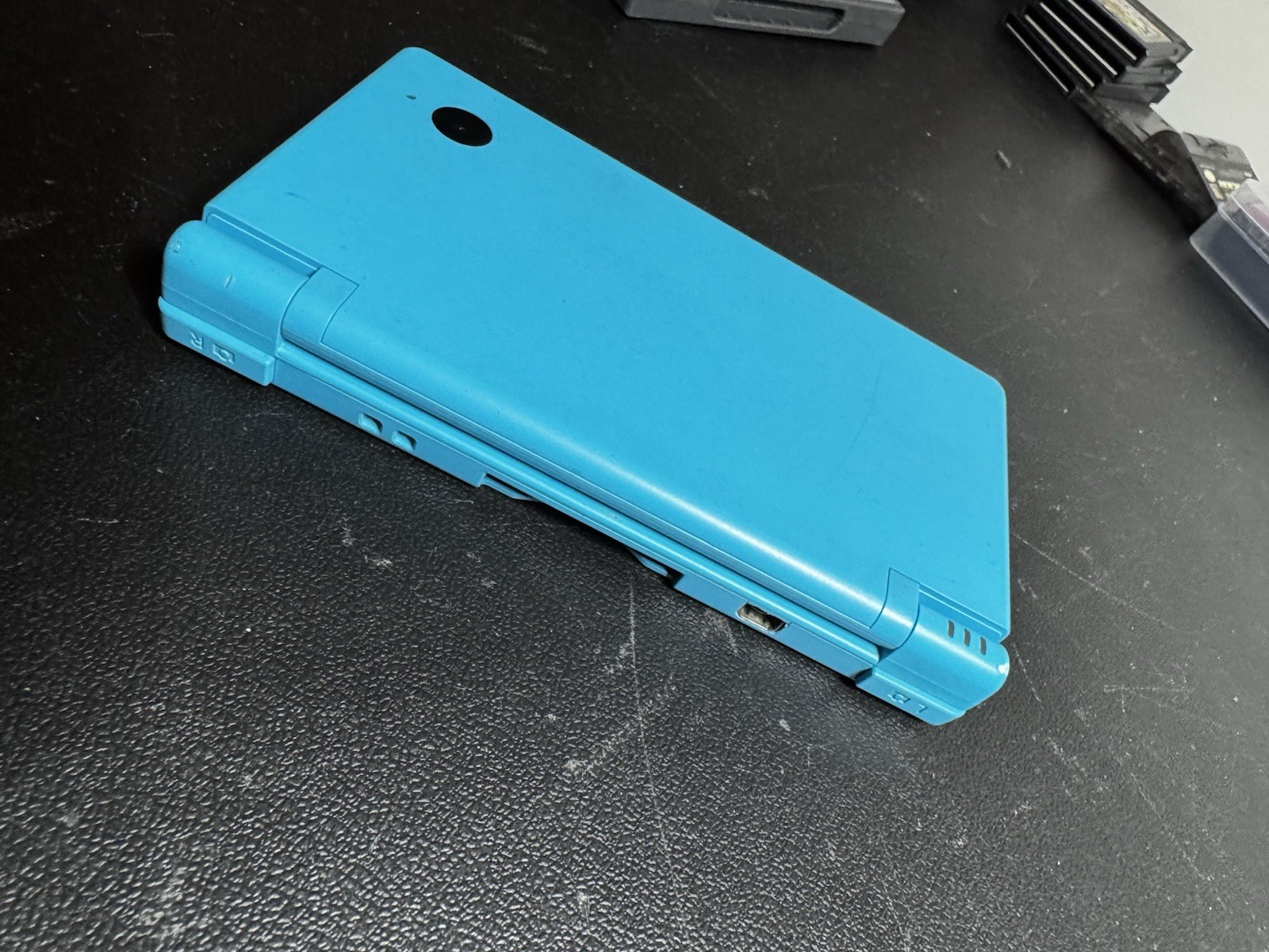 Nintendo DSi Ice Blue Handheld Console System W/ Charger & X-men Nice Condition