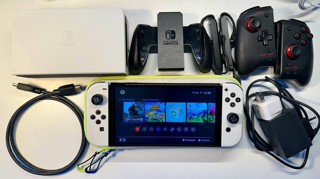 Nintendo Switch OLED Handheld Console – 64GB – White and gamepads
